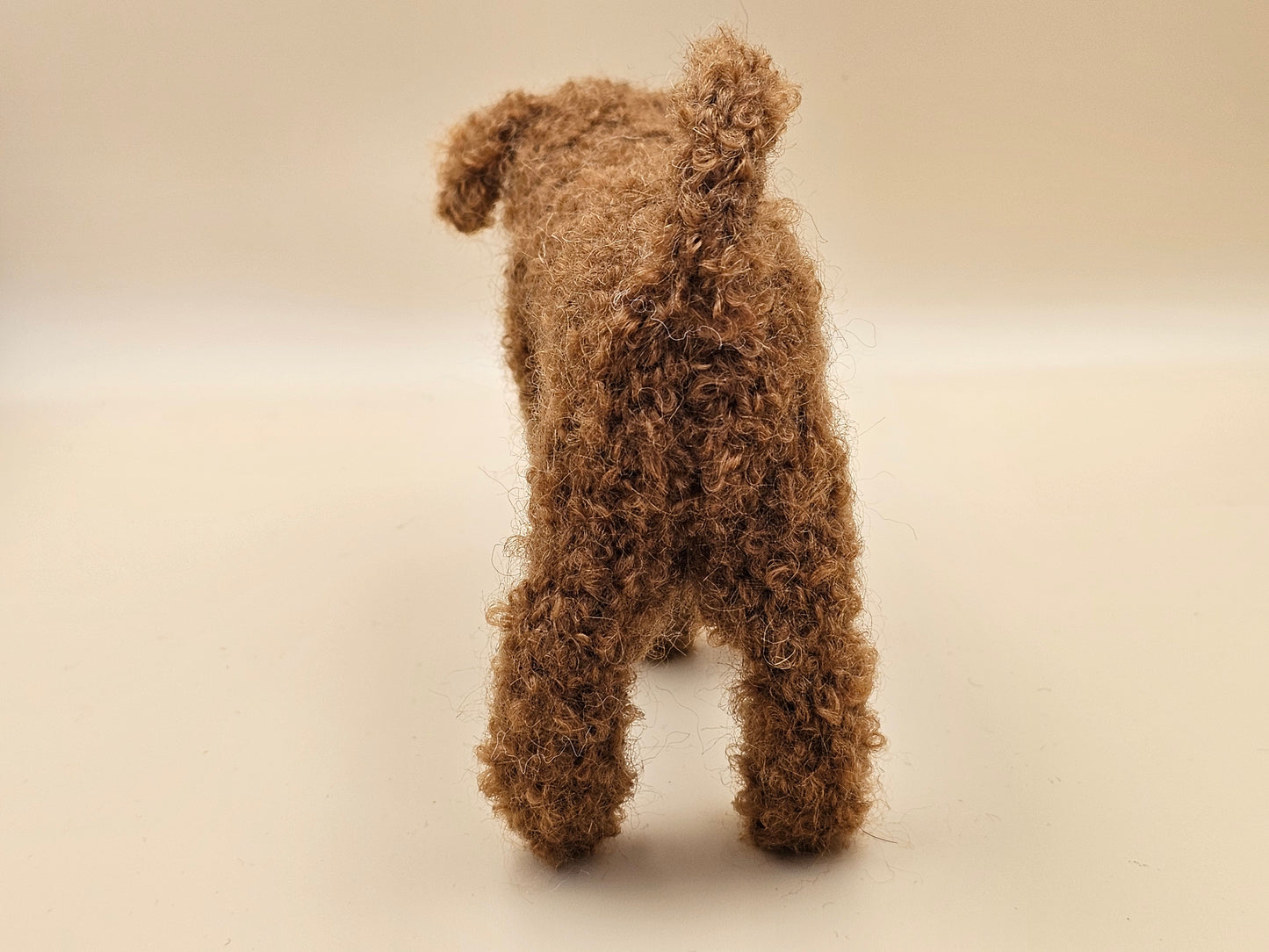 Fluffy handknitted fox red golden Labradoodle with movable head, legs and tail.