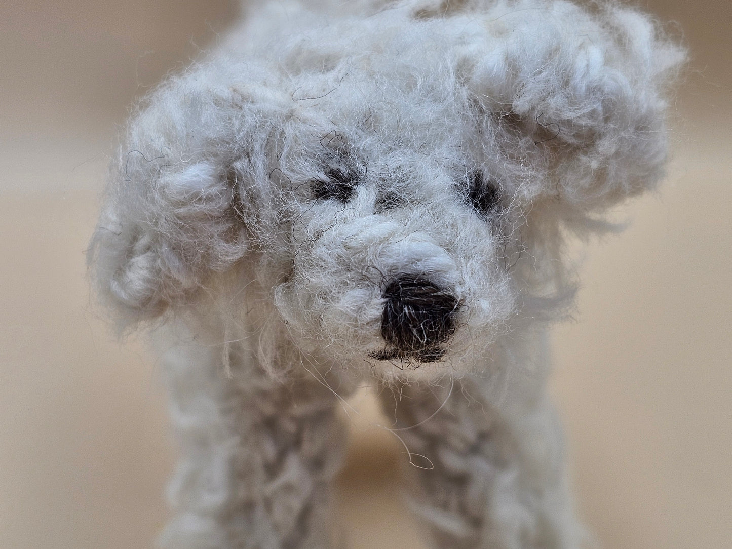 Fluffy handknitted hairy off white Labradoodle with movable head, legs and tail.